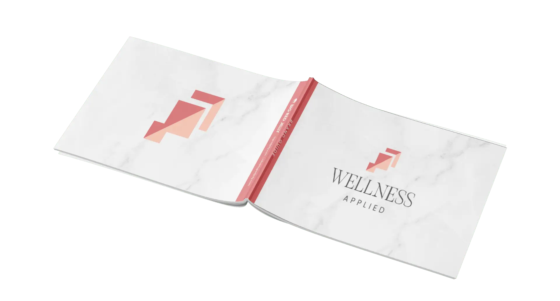 A white hardcover book with a marble texture, titled Wellness Applied in black text. The cover features a pink geometric logo, and the spine is red with white text. The book is open and lying flat.