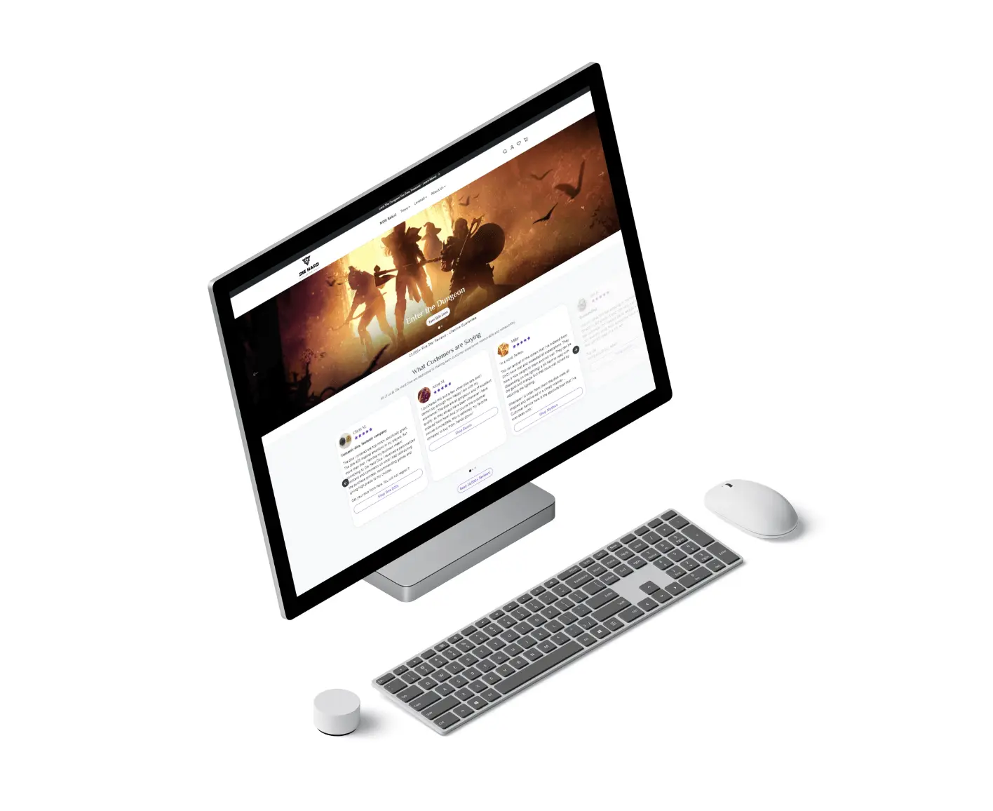 A desktop computer with a monitor displaying a website featuring a fantasy-themed banner, placed on a white surface alongside a wireless keyboard, mouse, and a small round control device.