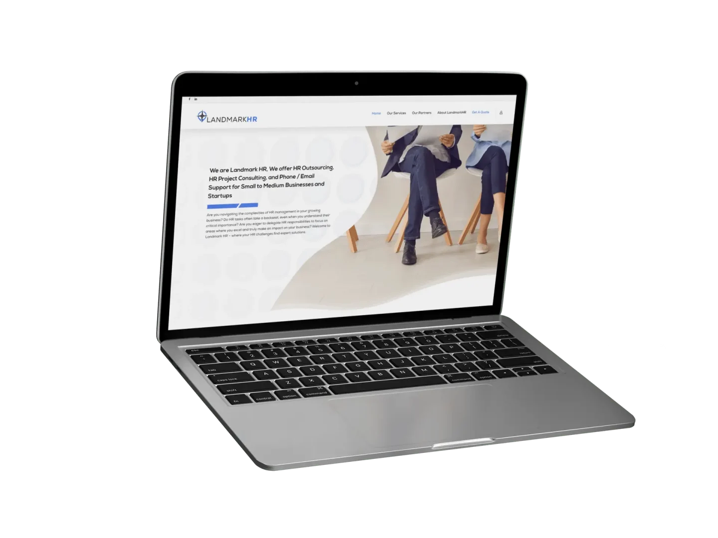 A laptop displaying a website for Landmarkhr, featuring HR and accounting services, with an image of a person in business attire sitting on chairs and site navigation menu at the top.
