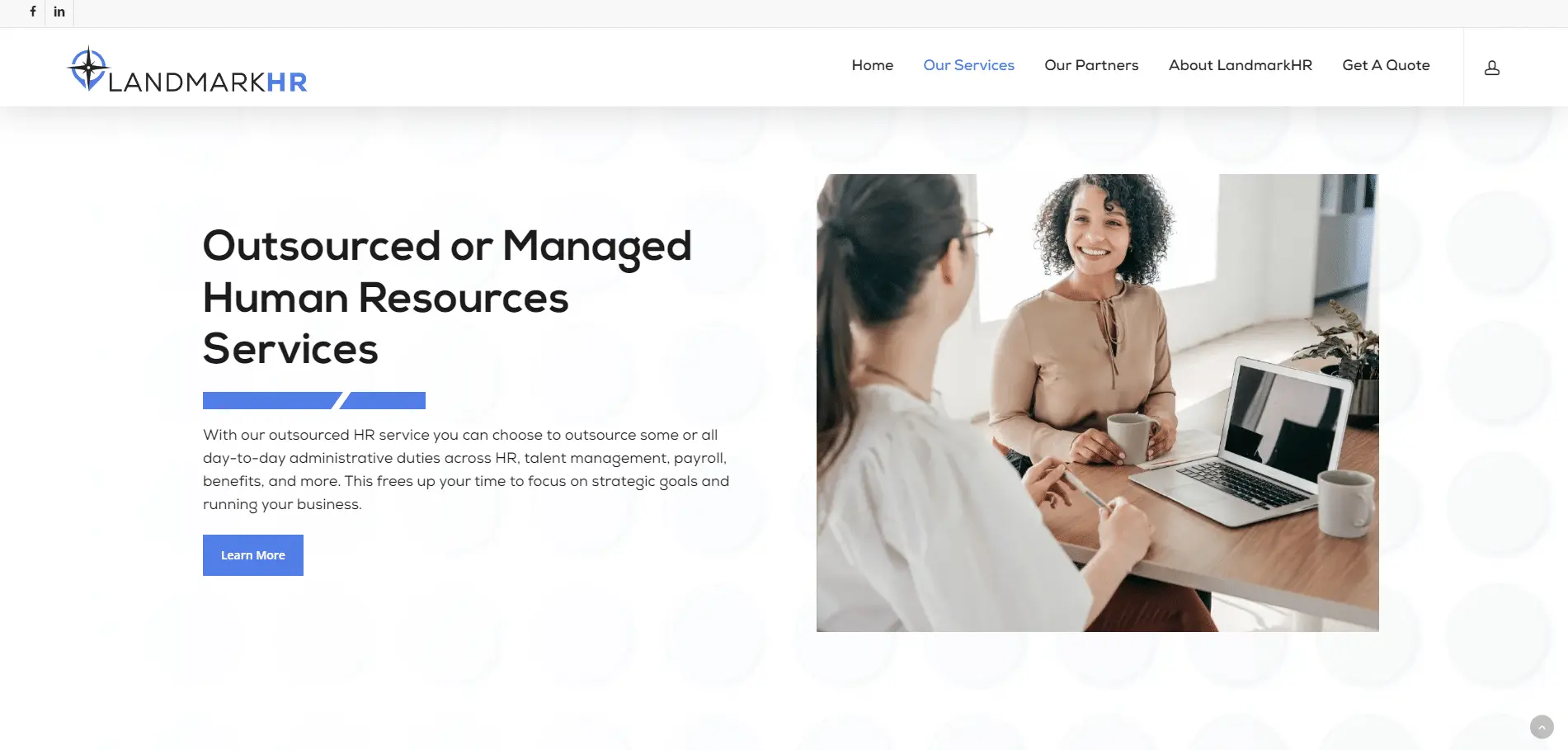 Landmark-HR-Portfolio-2 Screenshot of the LandmarkHR website showing two women having a business meeting at a desk with a laptop, with text promoting outsourced or managed human resources services on the left side.