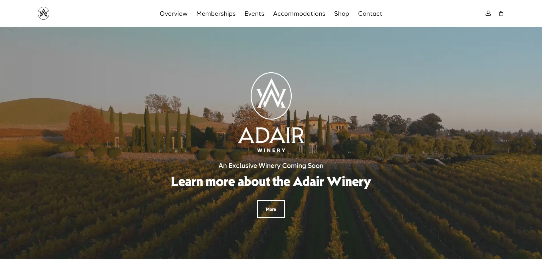 Adair Winery 1 A vineyard at sunset with rolling hills, trees, and a building in the background. The text reads “ADAIR WINERY – An Exclusive Winery Coming Soon” with a button to learn more about the Adair Winery.