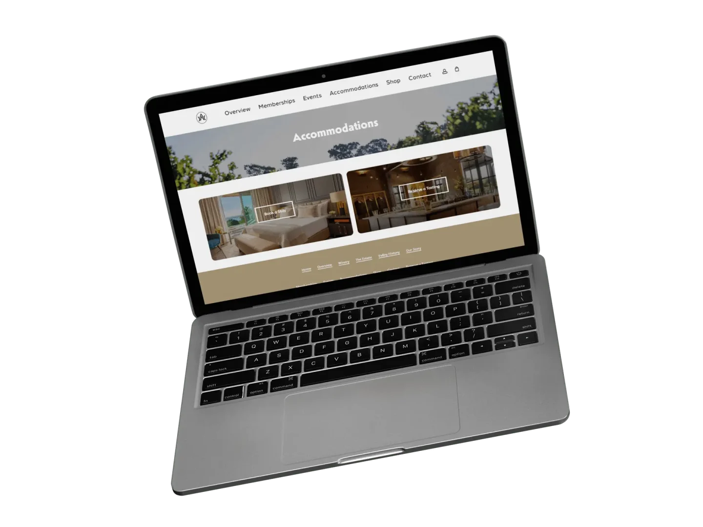 A laptop displaying a website’s accommodations page with images of two hotel rooms and a navigation menu at the top. The screen shows categories like Overview, Membership, Events, and Contact.