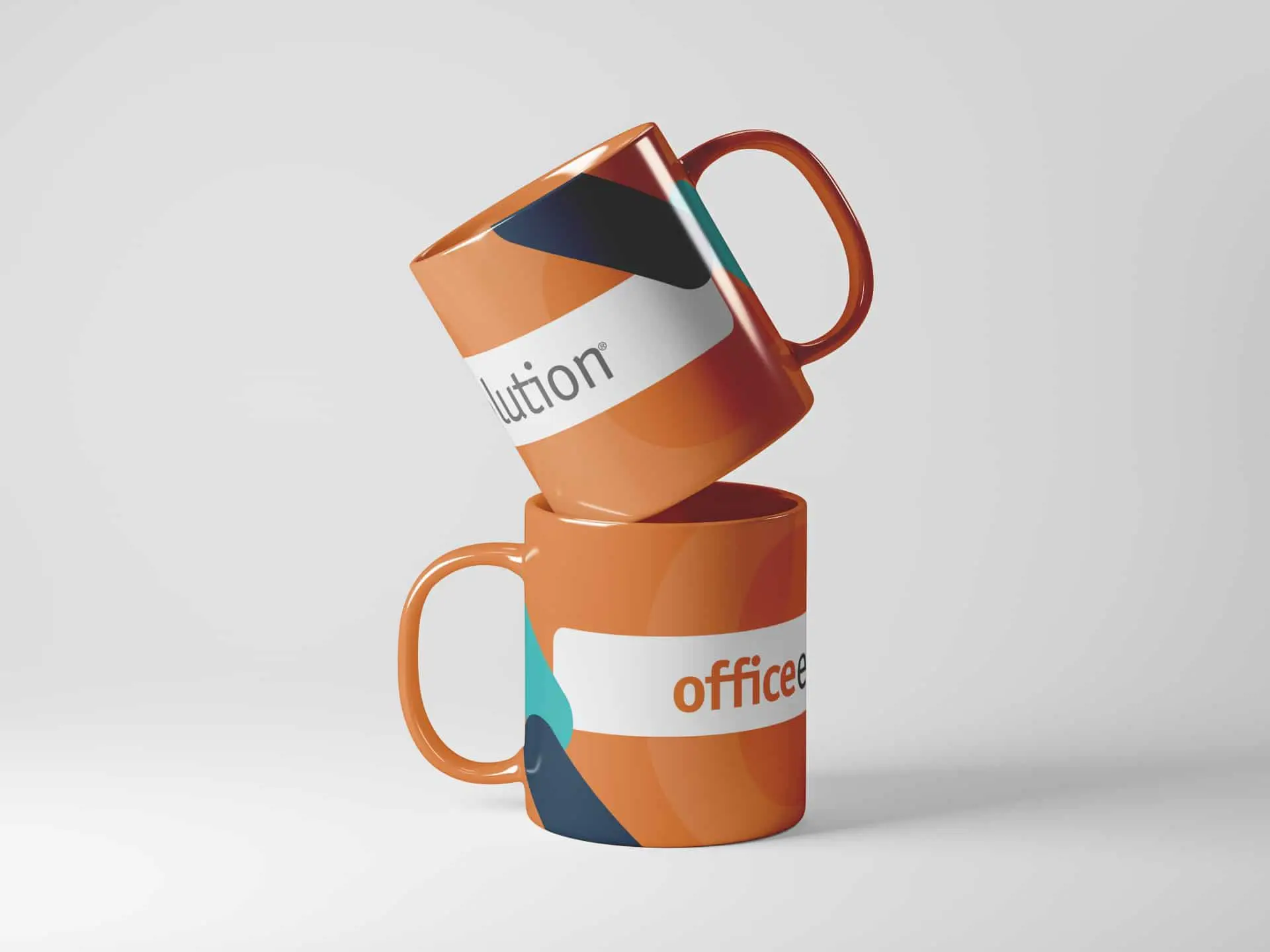 Two orange mugs with abstract patterns in teal, navy, and white are stacked on a white surface. The top mug is tilted, partially resting on the bottom one. Only partial words, “lution” and “office,” are visible on the mugs.