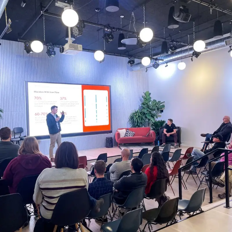A Big Red Jelly team member delivering a presentation on how to increase revenue as a small business.