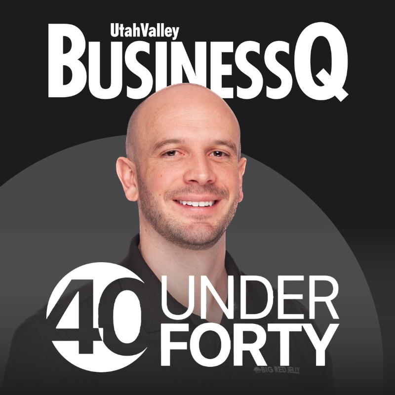 A smiling bald man with a trimmed beard is featured on the cover of Utah Valley BusinessQ magazine, with the text 40 under 40 displayed prominently below.