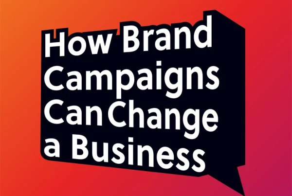White text on a black speech bubble reads “How Brand Campaigns Can Change a Business” against a red and orange gradient background.