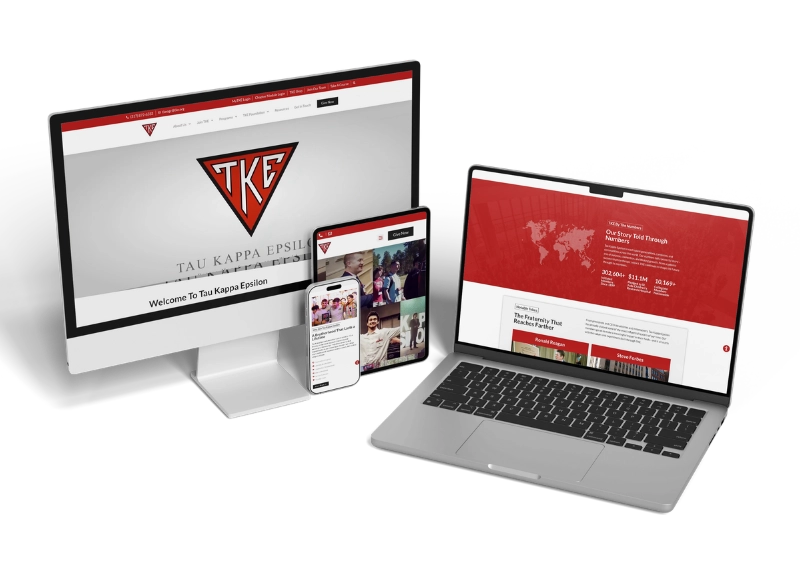 A desktop monitor, tablet, and laptop display the Tau Kappa Epsilon fraternity website, featuring a red and white theme with the TKE logo, interactive map, and various Tau Kappa Epsilon multimedia content on the screens.