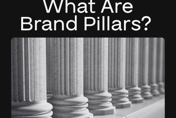 A row of classical stone pillars with the text What Are Brand Pillars? above, highlighting brand as a growth driver, and the Big Red Jelly logo at the top on a black background.