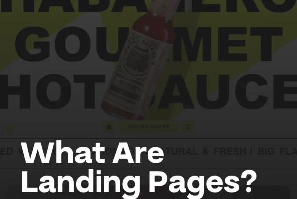 A bottle of hot sauce appears over bold yellow text, with the words What Is a Landing Page? (And What Isn’t?) in large white and orange font at the bottom.