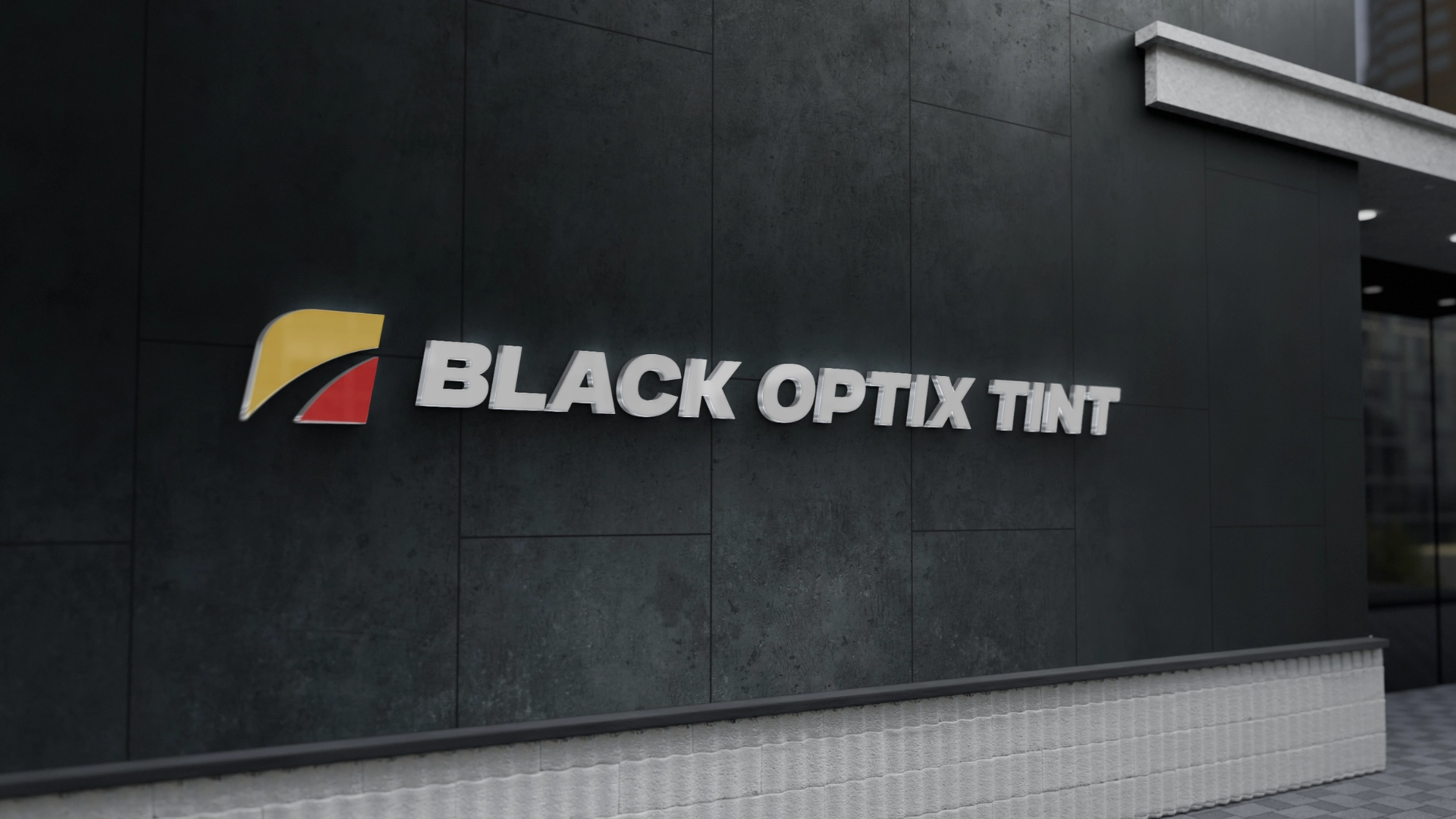 The exterior wall of a building features the BLACK OPTIX TINT logo in white letters, with a yellow and red graphic symbol on a dark gray tiled background.
