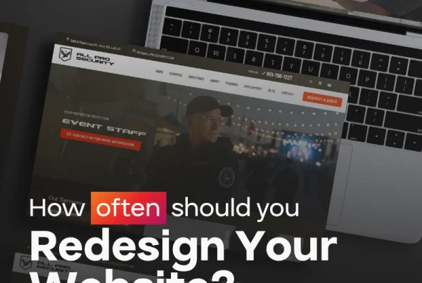 A laptop displaying a security company website, with the text How often should you Redesign Your Website? overlaid in bold white and red letters.